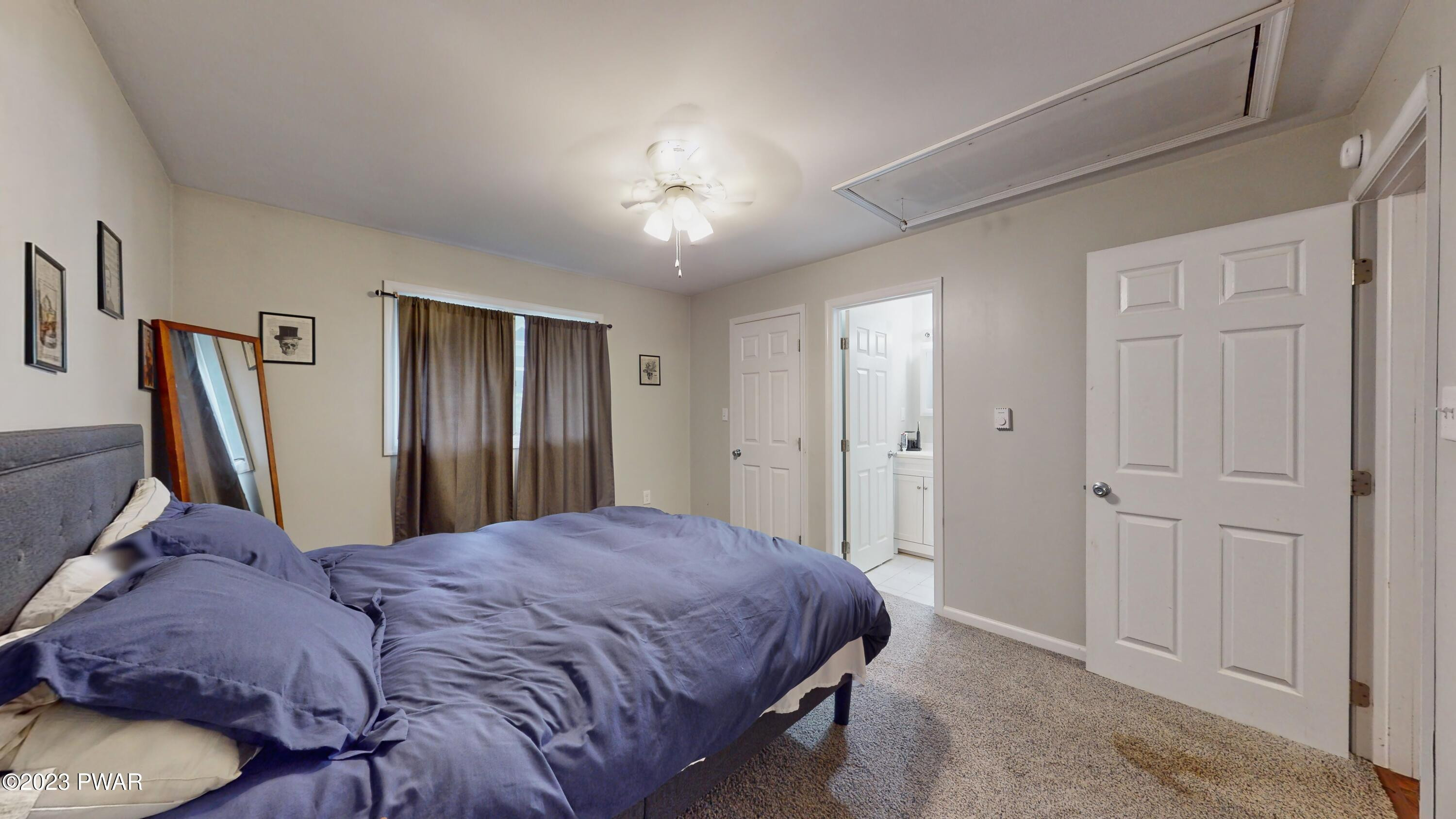 149 Walker Lake Road Shohola, PA 18458 - Photo 11 of 51 a bed sitting in a bedroom next to a cabinet