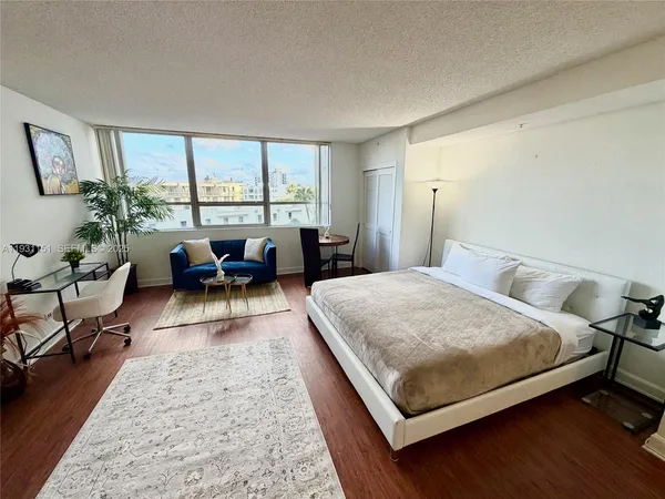 a bed room with a bed and a couch