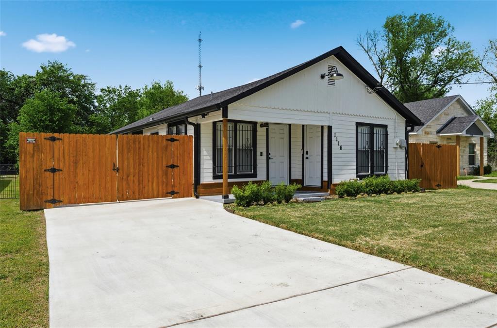 1116 Houston Street Waco, TX 76704 - Photo 2 of 16 View of front of house with a gate and concrete driveway