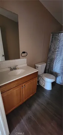 a spacious bathroom with a double vanity sink and a mirror