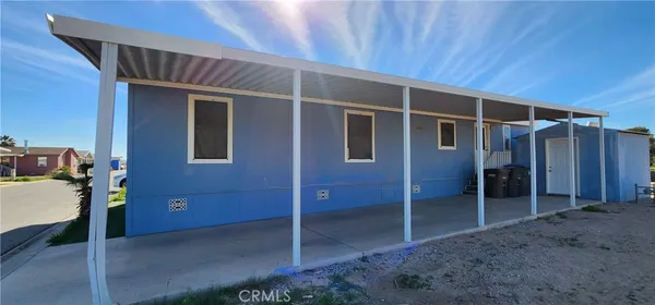 a view of an empty room with wooden walls