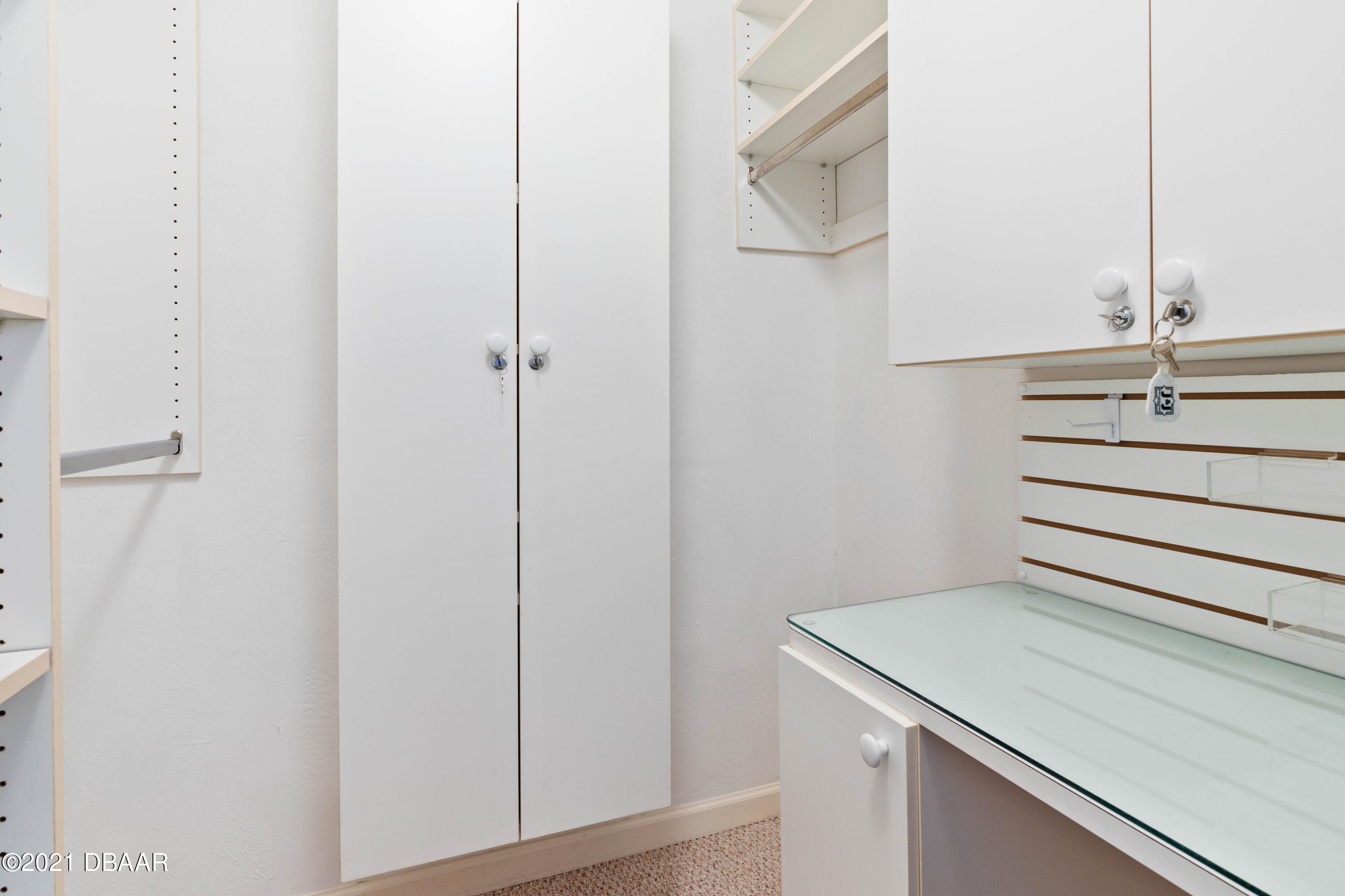 1051 Ocean Shore Boulevard, Unit 1102 Ormond Beach, FL 32176 - Photo 11 of 29 a bathroom with a sink and a mirror