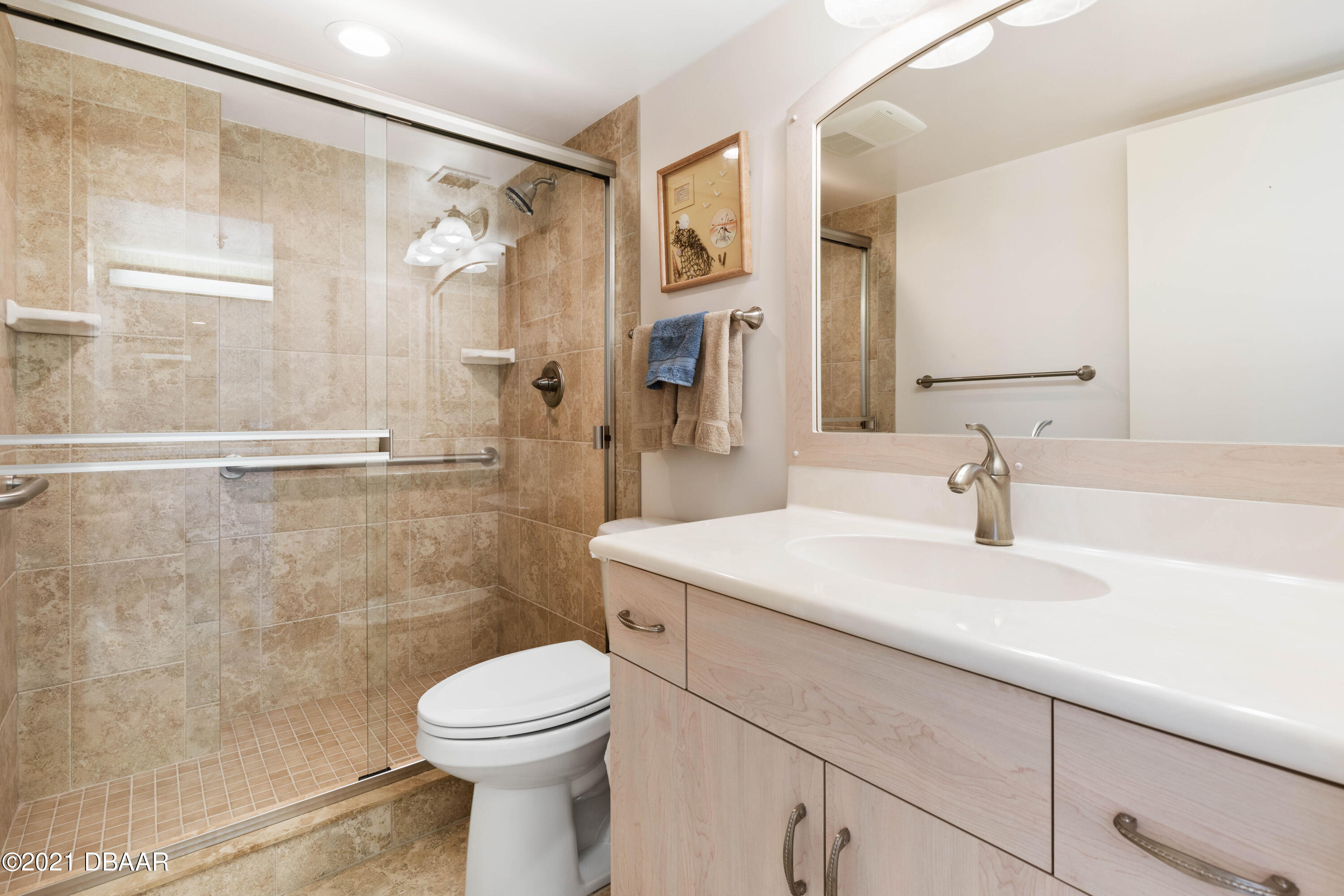 1051 Ocean Shore Boulevard, Unit 1102 Ormond Beach, FL 32176 - Photo 13 of 29 a bathroom with a sink a toilet and shower