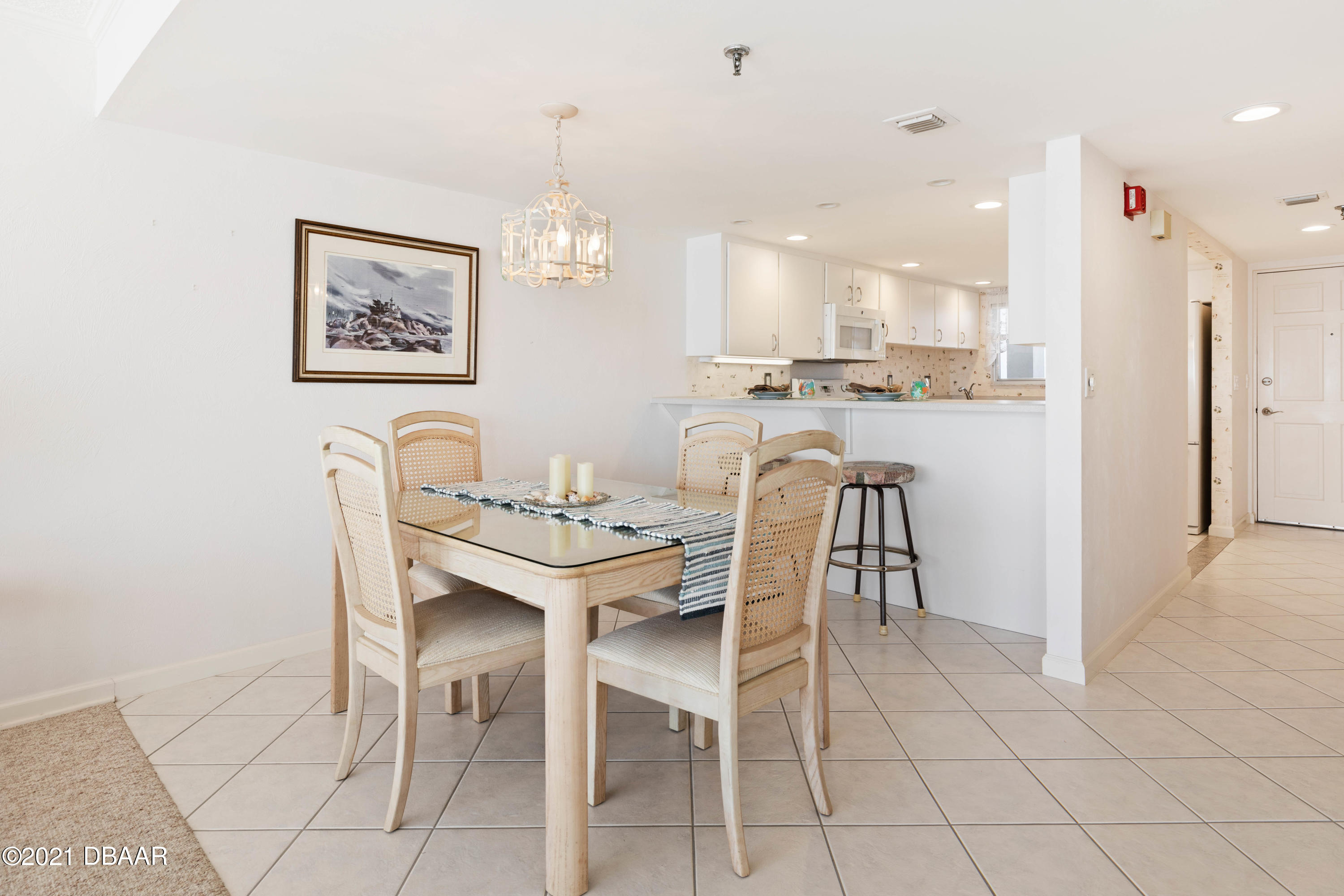 1051 Ocean Shore Boulevard, Unit 1102 Ormond Beach, FL 32176 - Photo 16 of 29 a view of a dining room with furniture