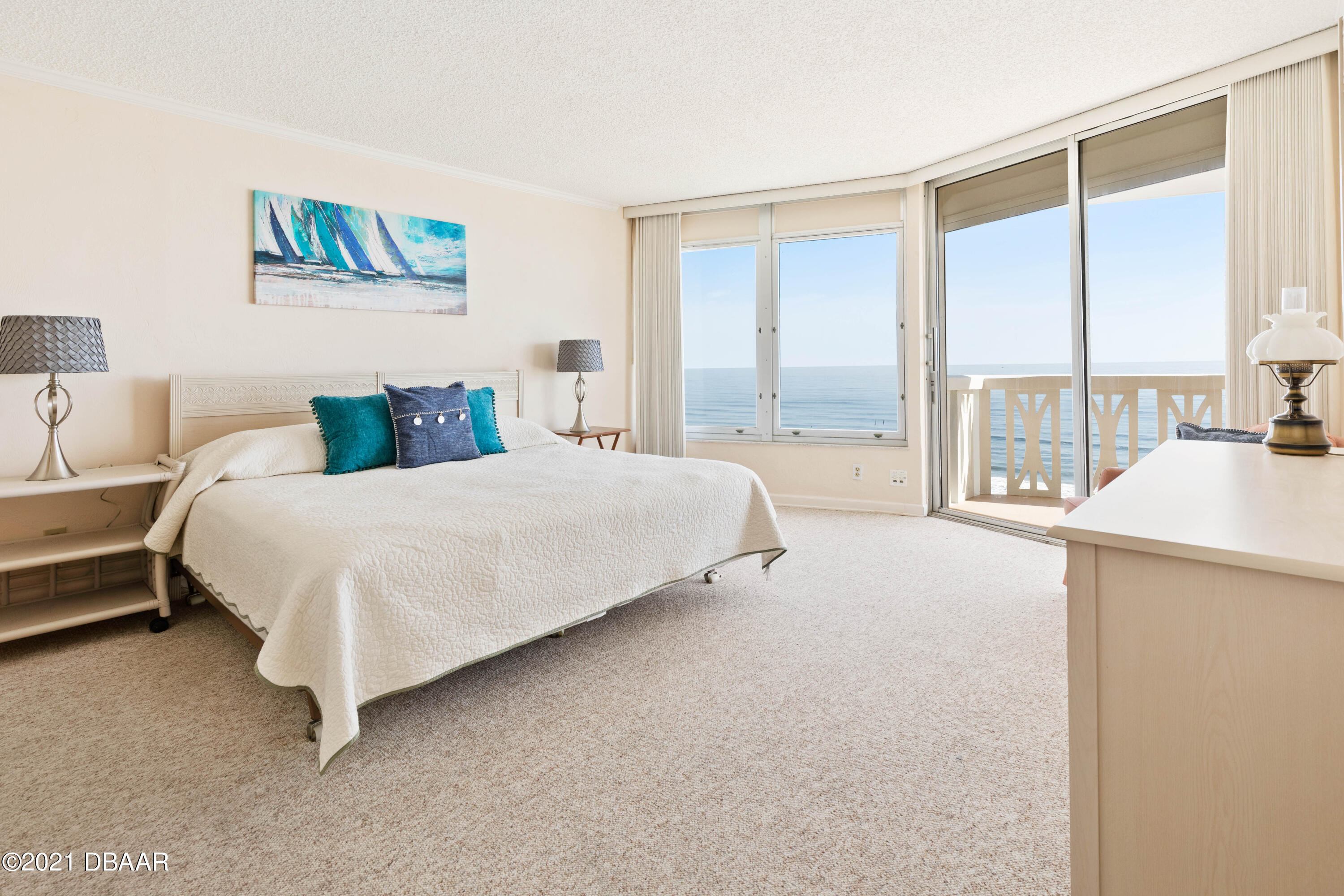 1051 Ocean Shore Boulevard, Unit 1102 Ormond Beach, FL 32176 - Photo 4 of 29 a bedroom with a bed and a large window