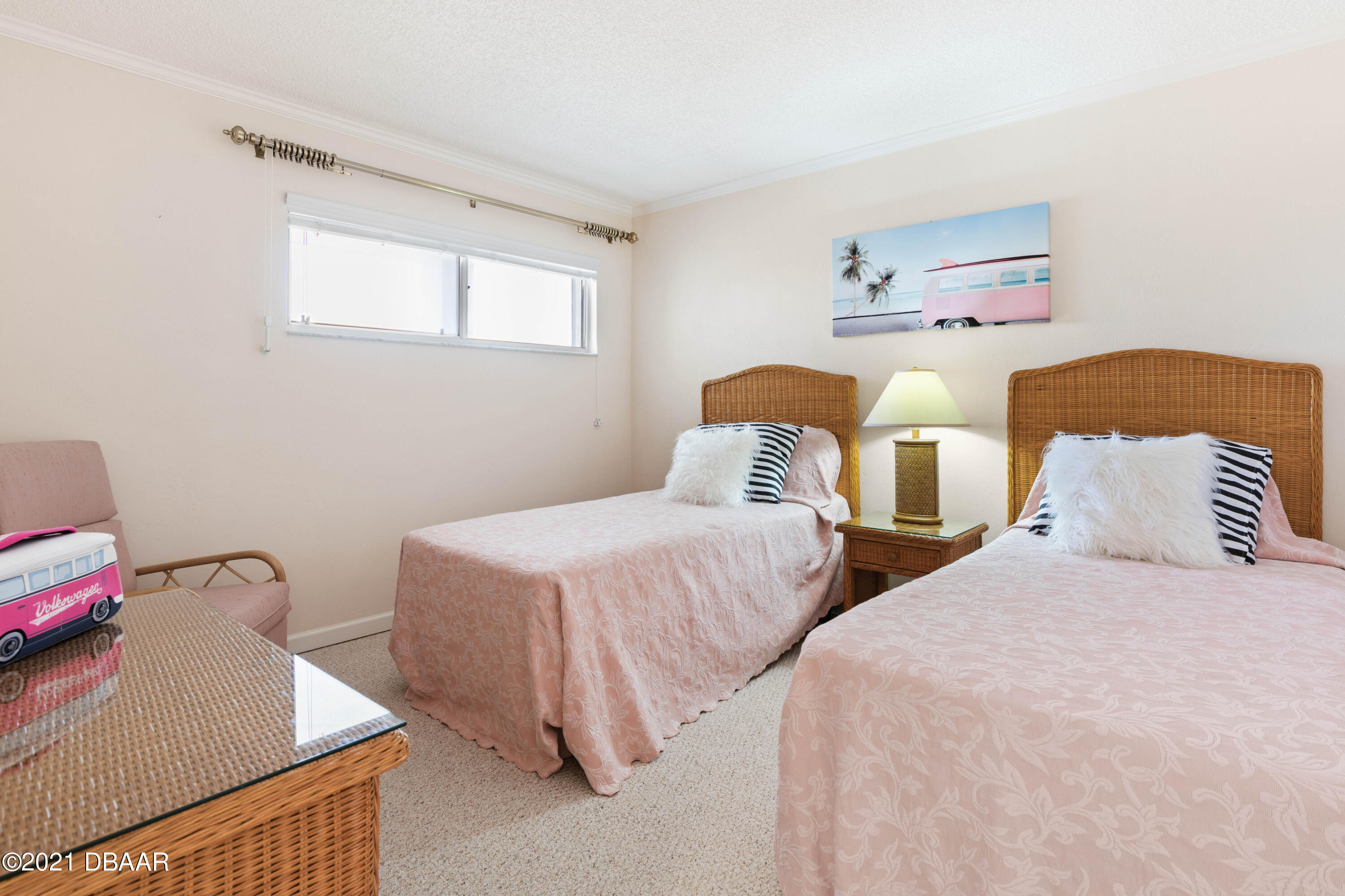1051 Ocean Shore Boulevard, Unit 1102 Ormond Beach, FL 32176 - Photo 10 of 29 a bedroom with two beds and painted walls