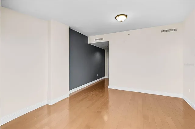 a bathroom with a bathtub sink and mirror