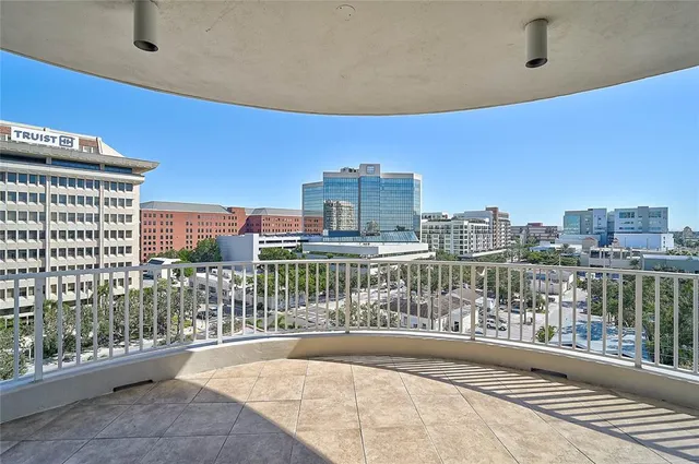 a living room with furniture potted plant and a fireplace