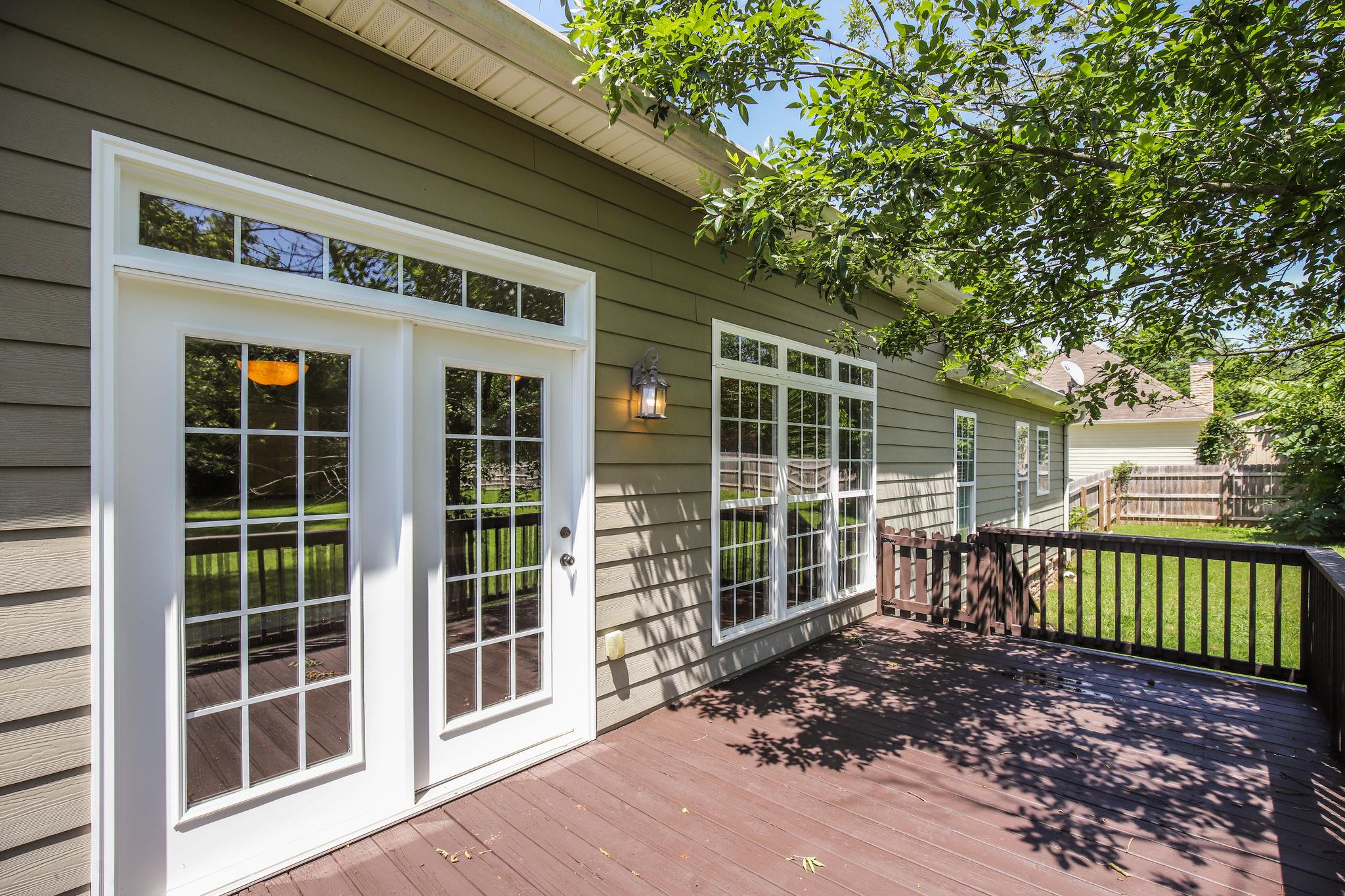 224 Curd Road Mount Juliet, TN 37122 - Photo 22 of 30 a view of a house with a large window and wooden fence