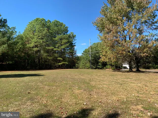 a swimming pool view with a seating space