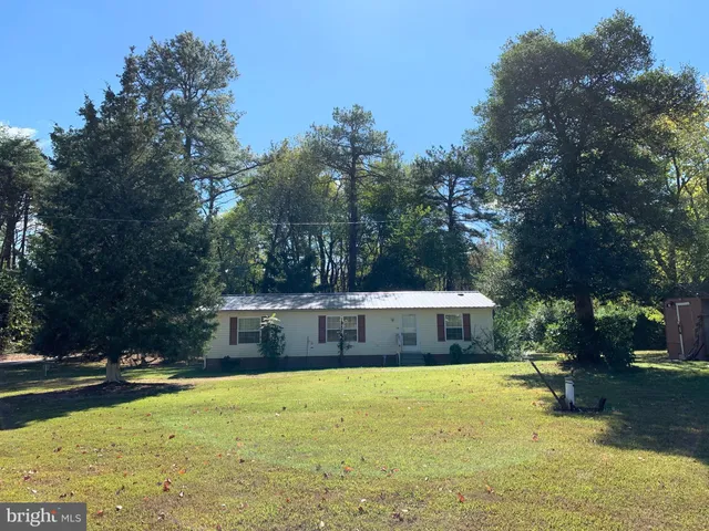 a view of swimming pool with trees in the background