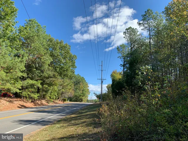a view of outdoor space with green field and trees