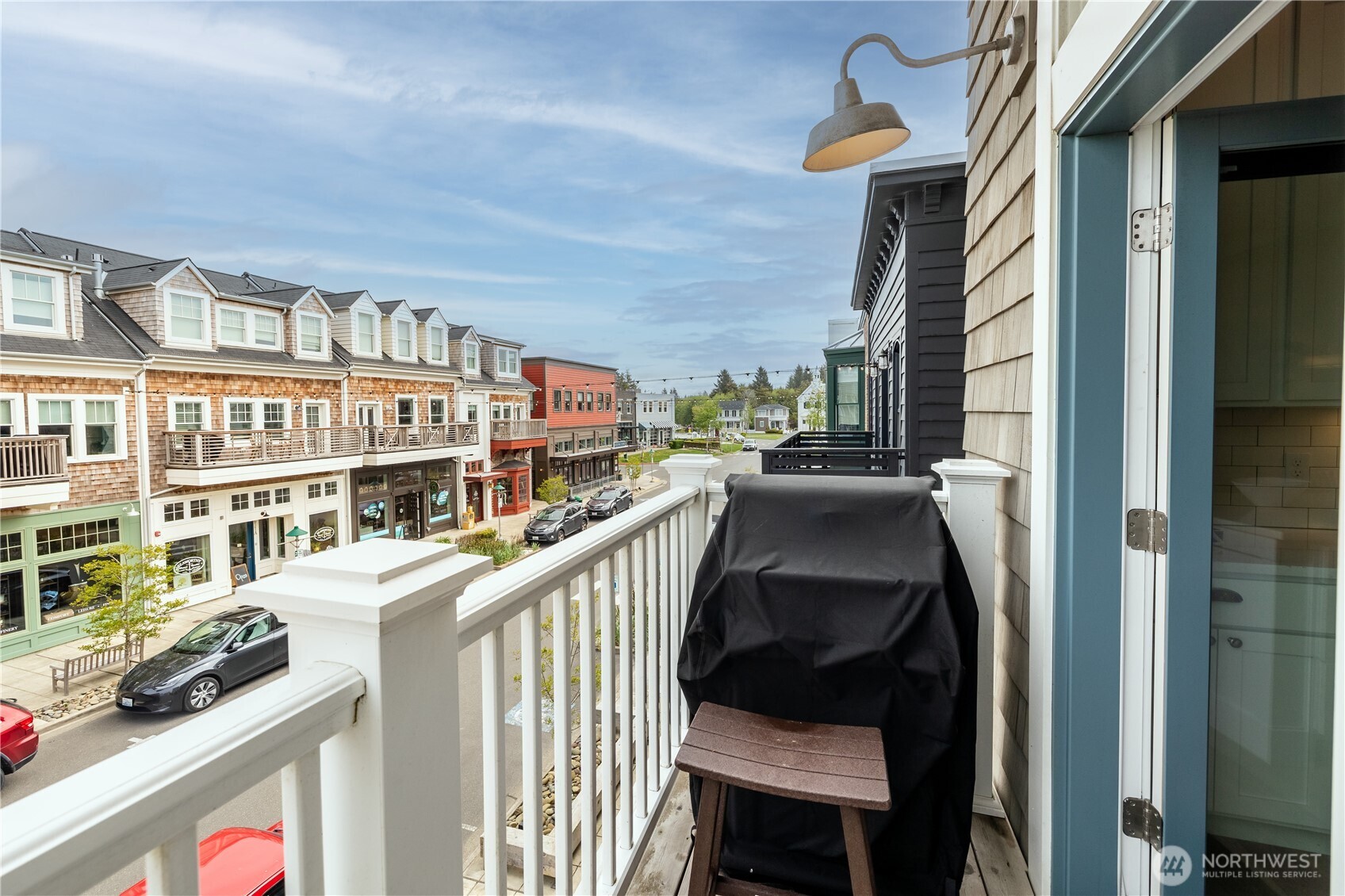 204 Market Street, Unit B Pacific Beach, WA 98571 - Photo 20 of 25 a view of a balcony with furniture and a stove