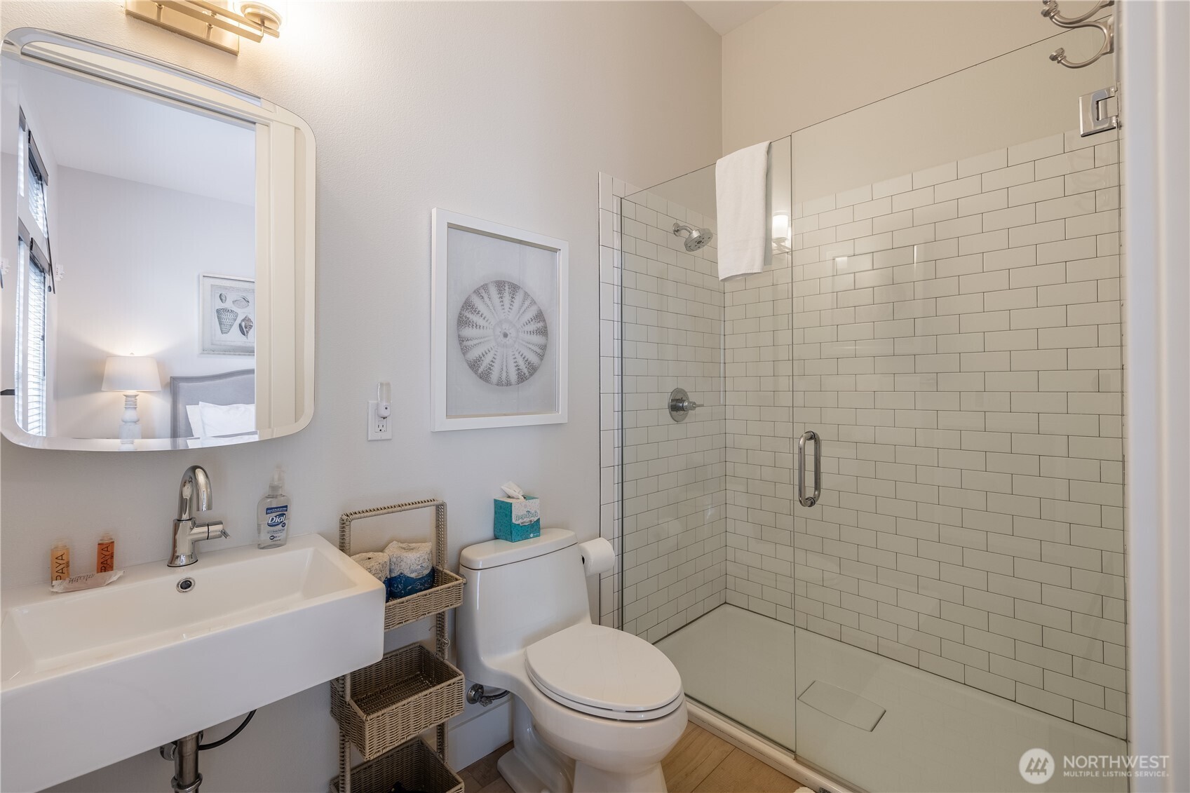204 Market Street, Unit B Pacific Beach, WA 98571 - Photo 5 of 25 a bathroom with a sink a toilet and shower