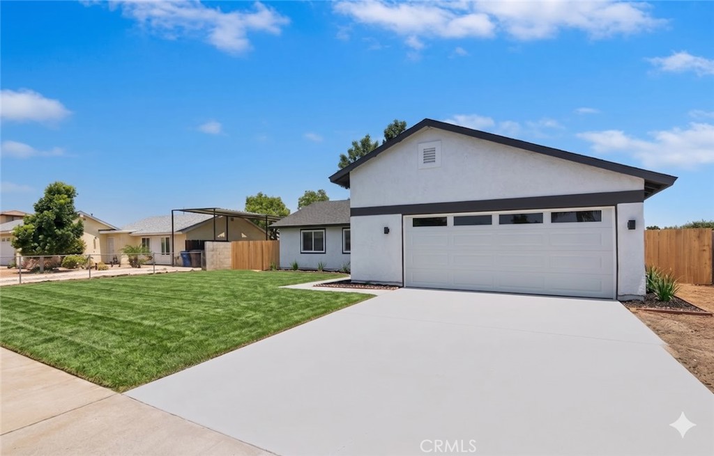 a house with yard in front of it