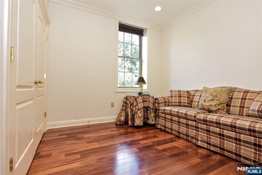 4201 Rio Vista Drive, Unit 4201 Mahwah, NJ 07430 - Photo 16 of 34 a view of a bedroom with wooden floor and windows