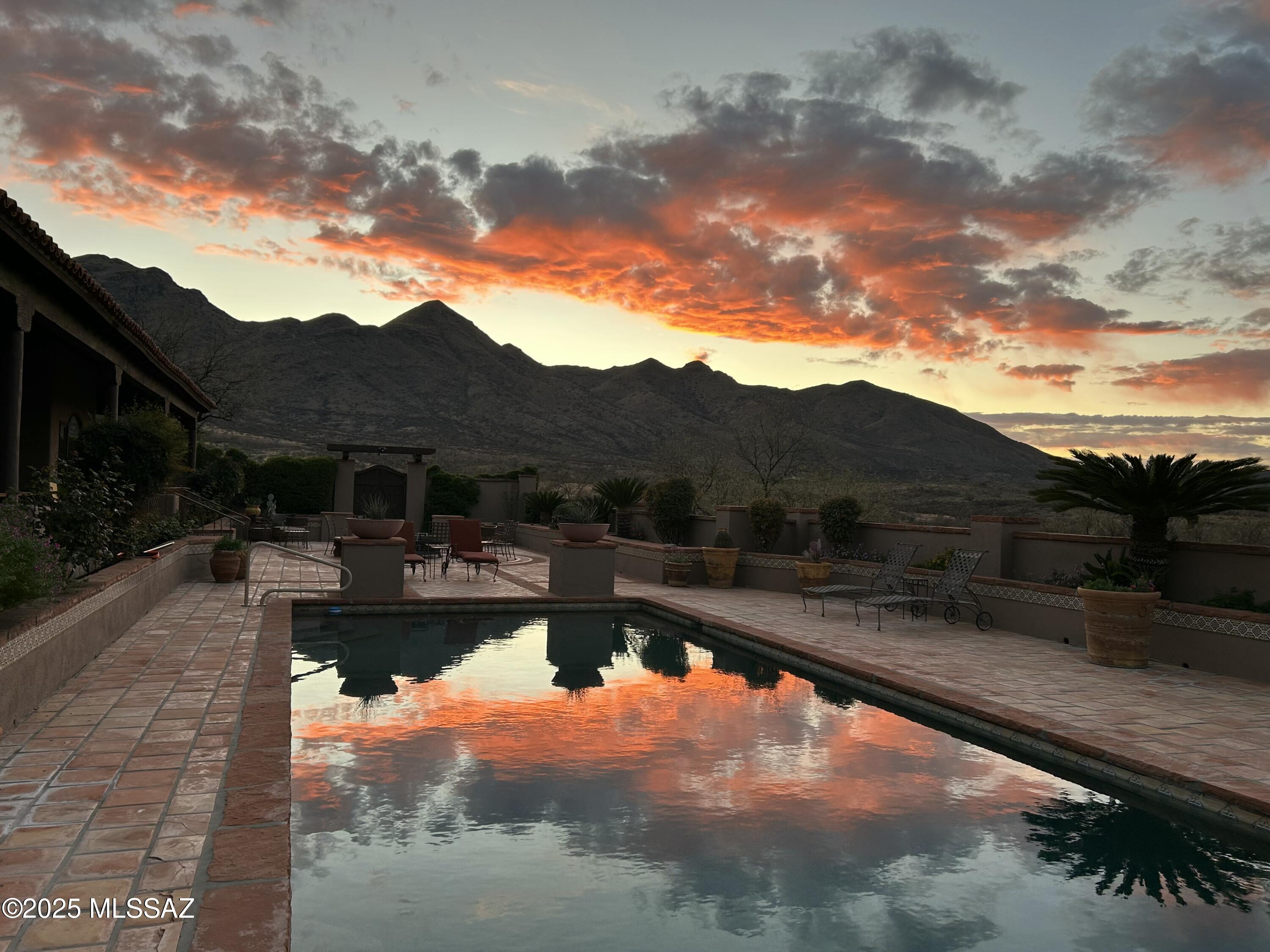 1265 Morning Star Drive Rio Rico, AZ 85648 - Photo 12 of 50 a view of a swimming pool with a yard