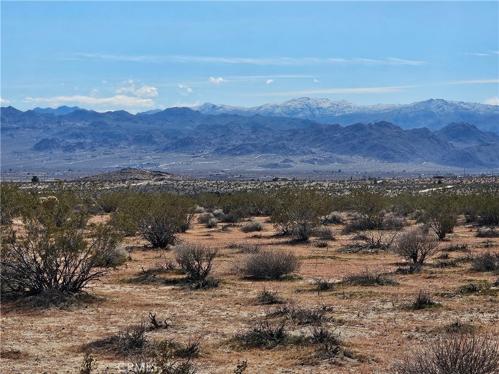 0 Avenida Del Sol Joshua Tree, CA 92252 - Photo 3 of 4 a view of a lake with mountains in the background