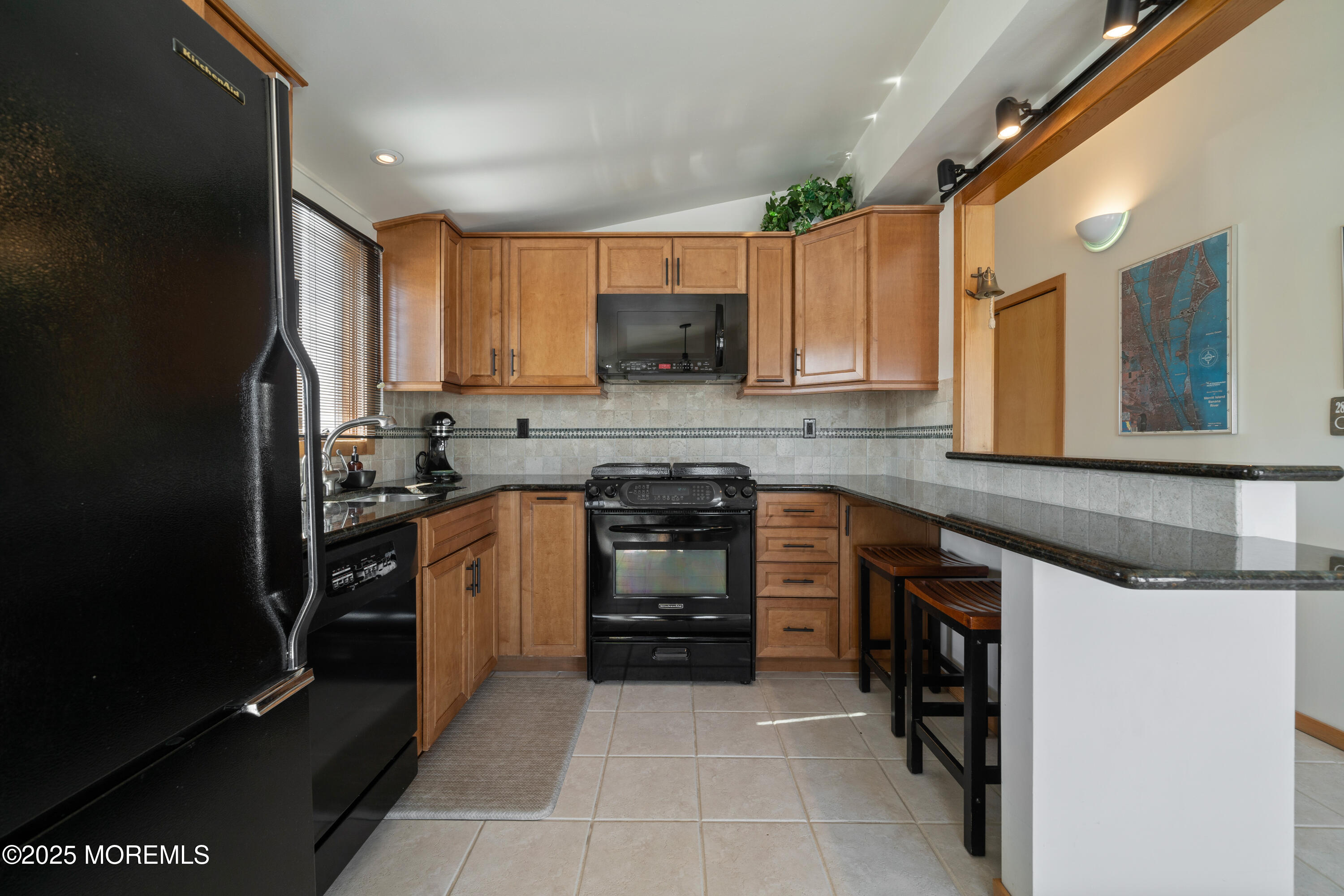 1211 Gemini Court Forked River, NJ 08731 - Photo 17 of 40 a kitchen with a sink stove and cabinets