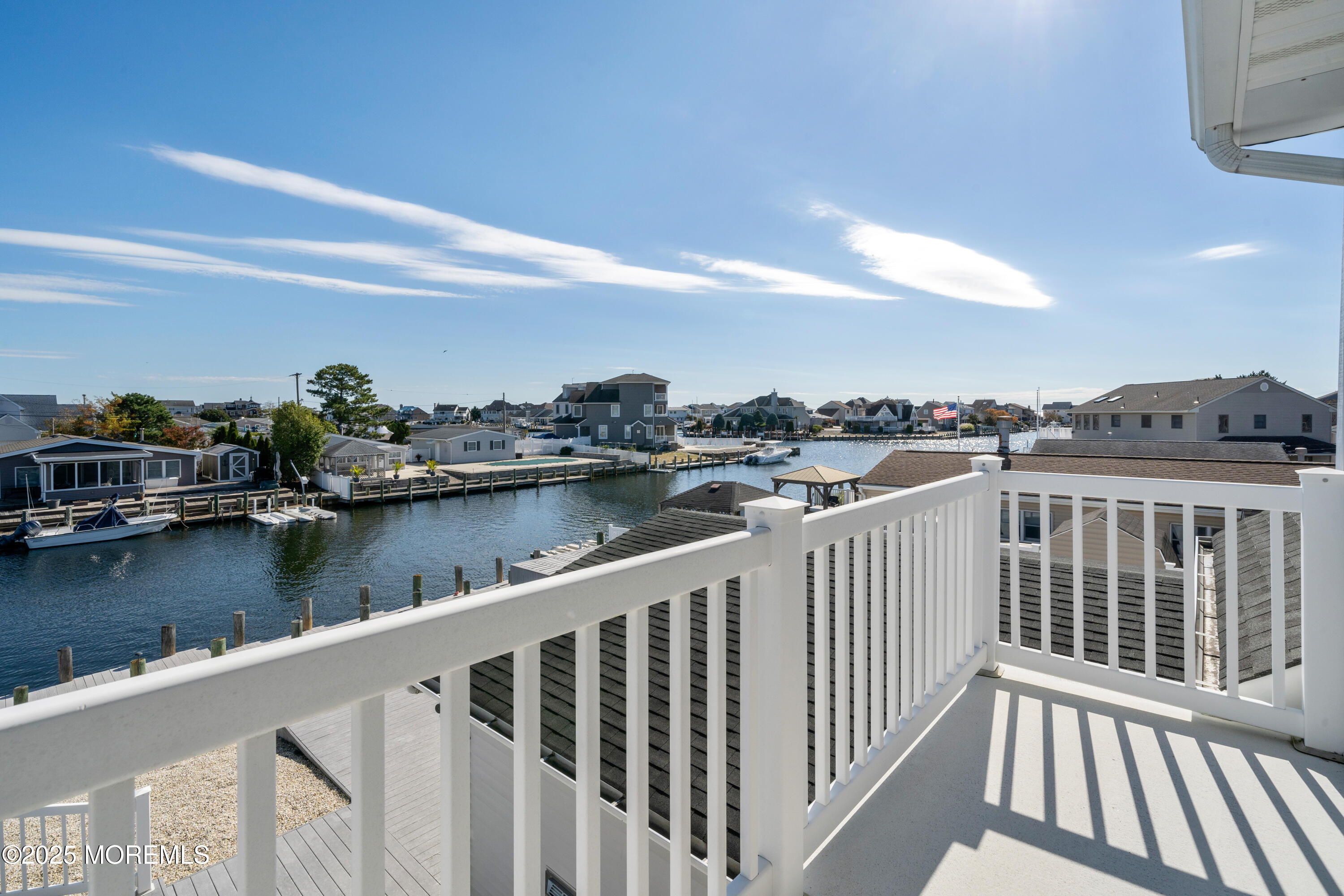 1211 Gemini Court Forked River, NJ 08731 - Photo 21 of 40 a view of a lake from a balcony