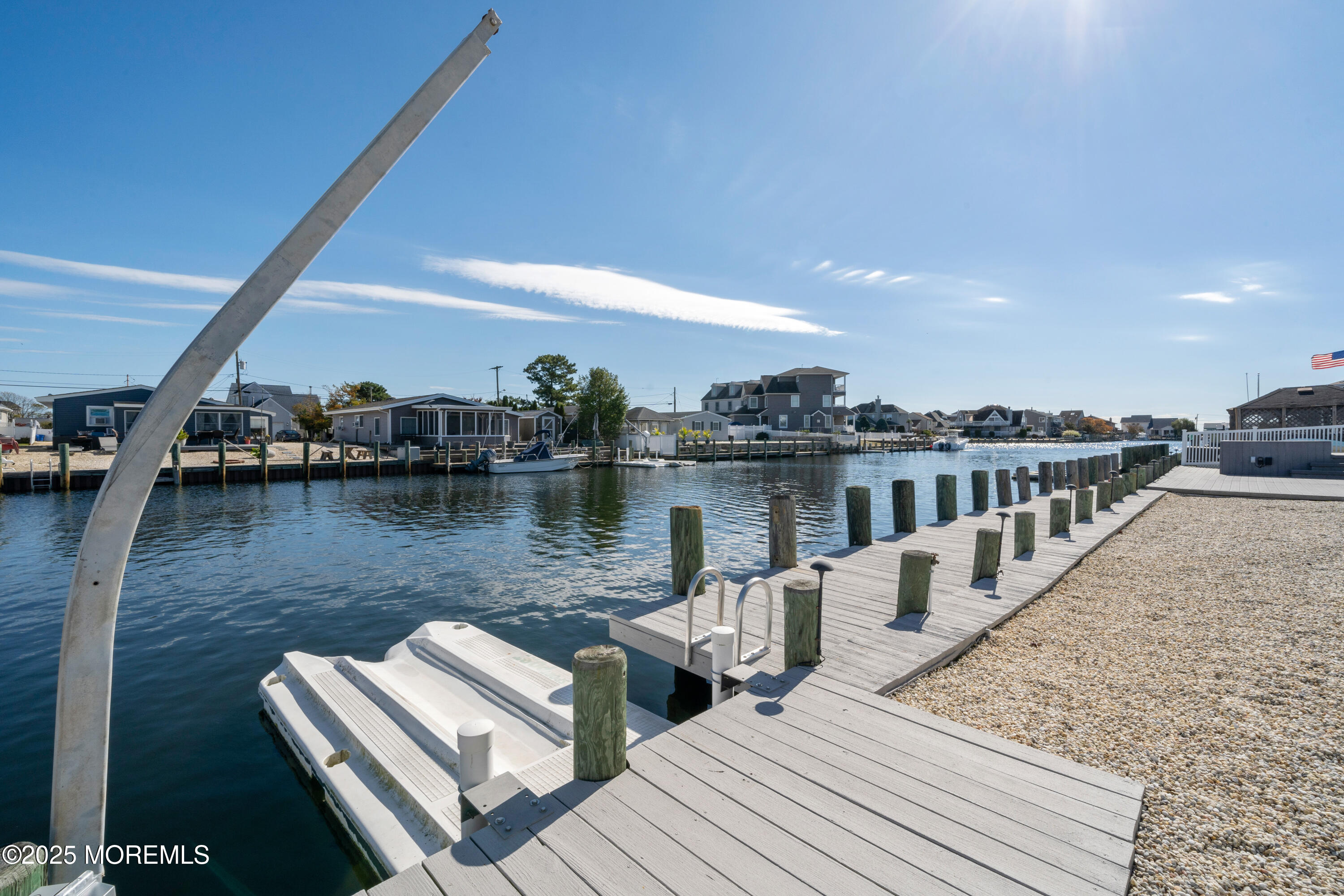 1211 Gemini Court Forked River, NJ 08731 - Photo 29 of 40 a view of a lake with outdoor seating