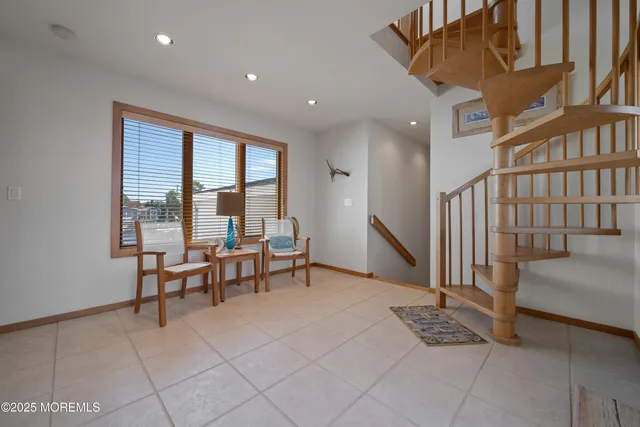 a view of a livingroom with furniture and a window