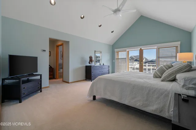 a bed room with a bed and a television