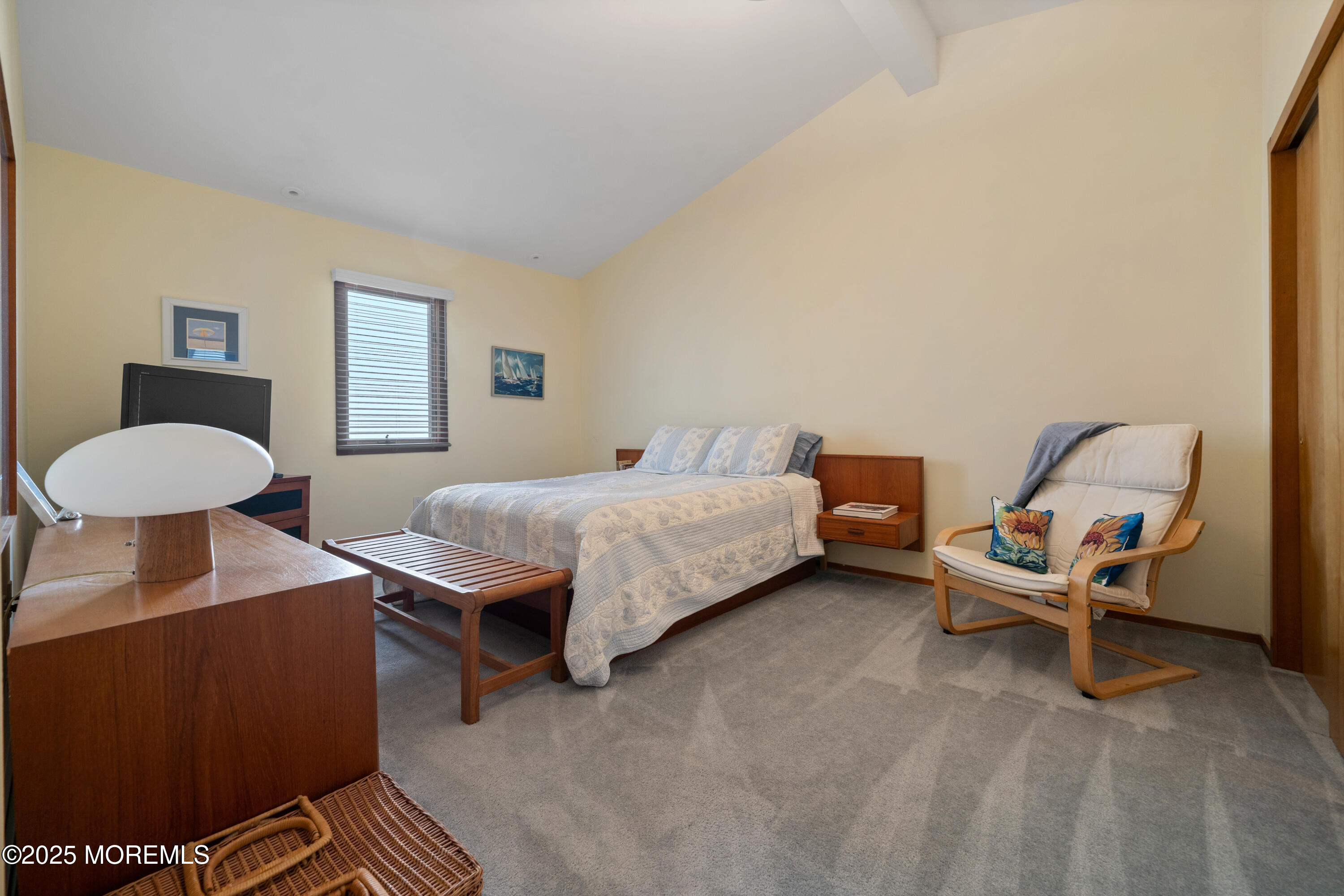 1211 Gemini Court Forked River, NJ 08731 - Photo 10 of 40 a bedroom with a bed and a chandelier