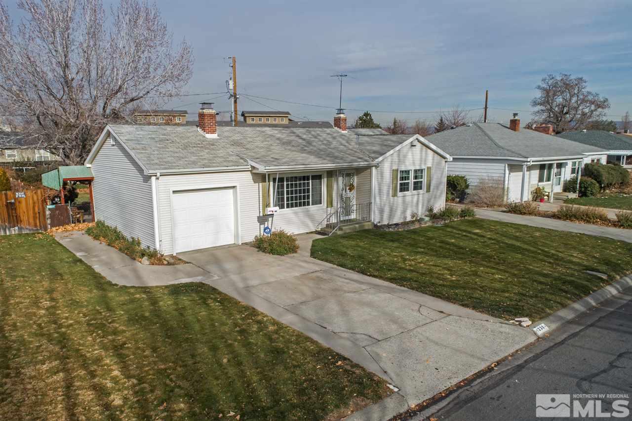 1235 Curti Drive Reno, NV 89502 - Photo 1 of 1 a front view of a house with a yard