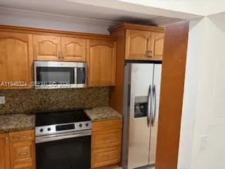 a kitchen with a stove and a microwave
