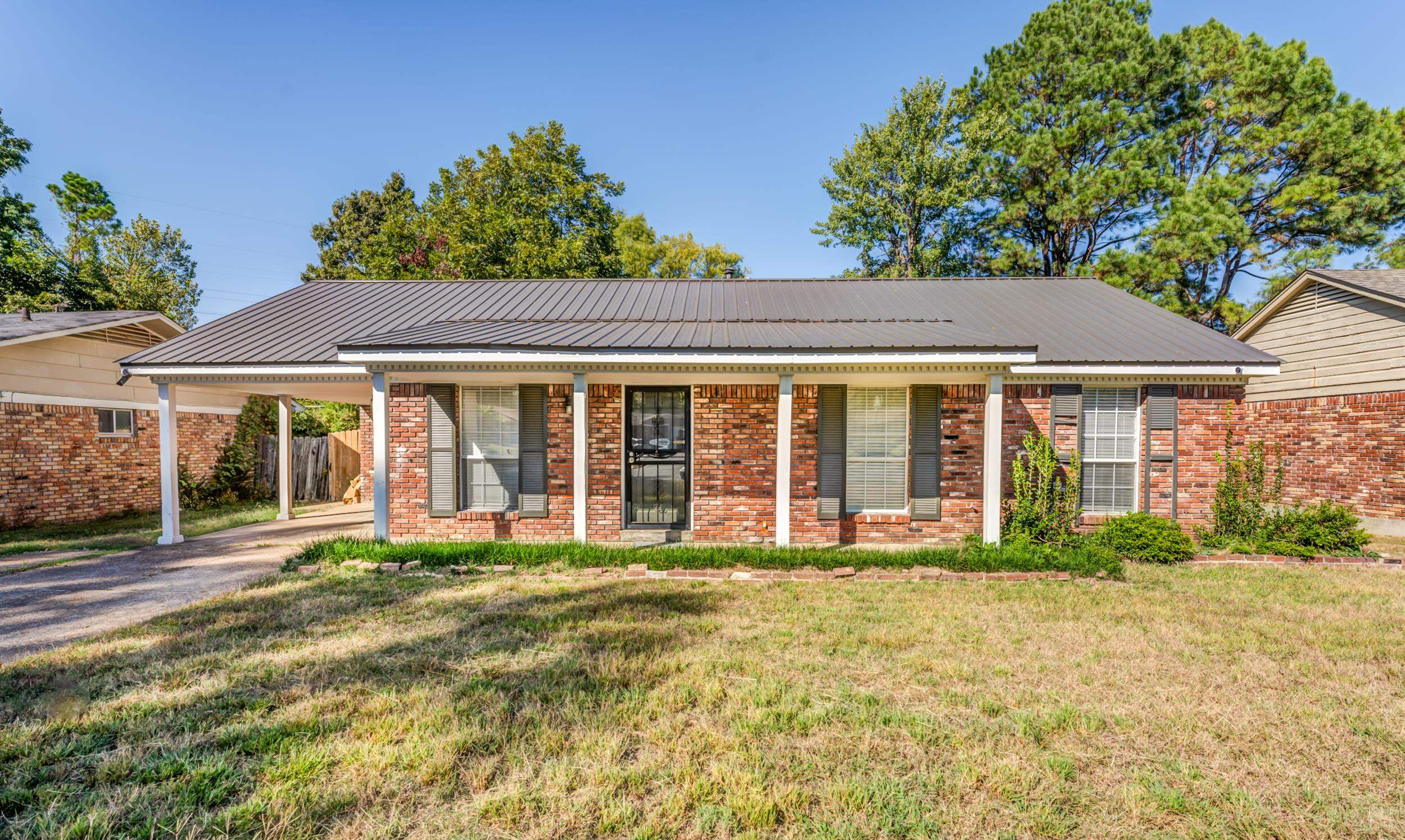 2865 Knightway Road Memphis, TN 38118 - Photo 1 of 19 a front view of a house with a yard
