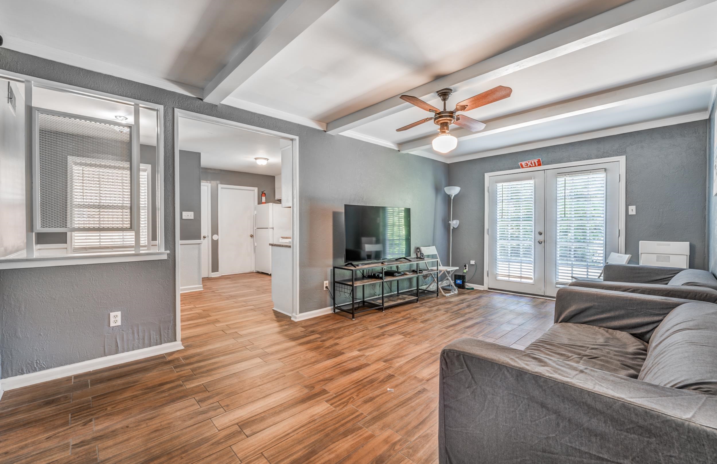 2865 Knightway Road Memphis, TN 38118 - Photo 5 of 19 a living room with furniture and a flat screen tv with wooden floor
