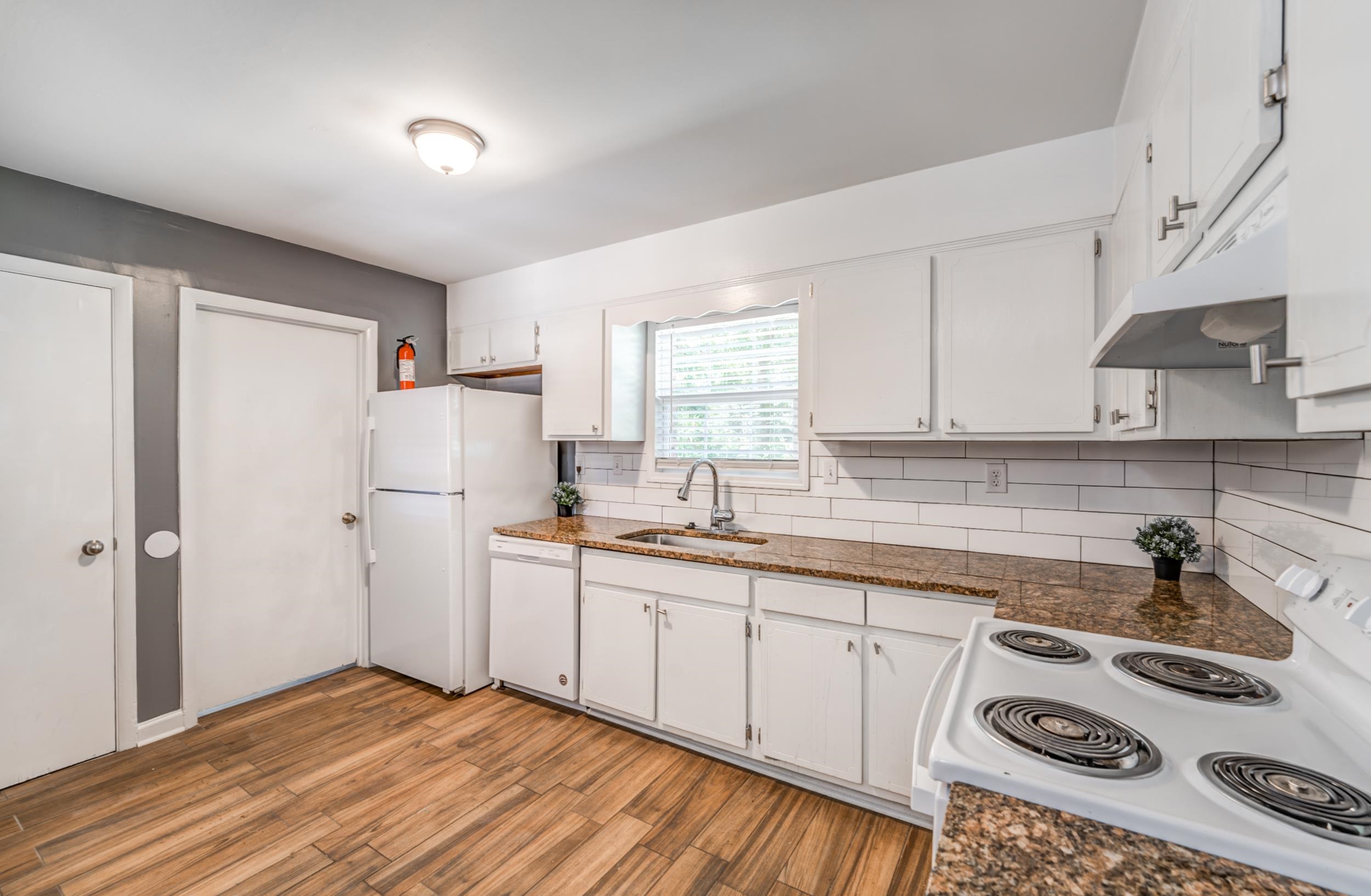 2865 Knightway Road Memphis, TN 38118 - Photo 7 of 19 a kitchen with refrigerator and cabinets