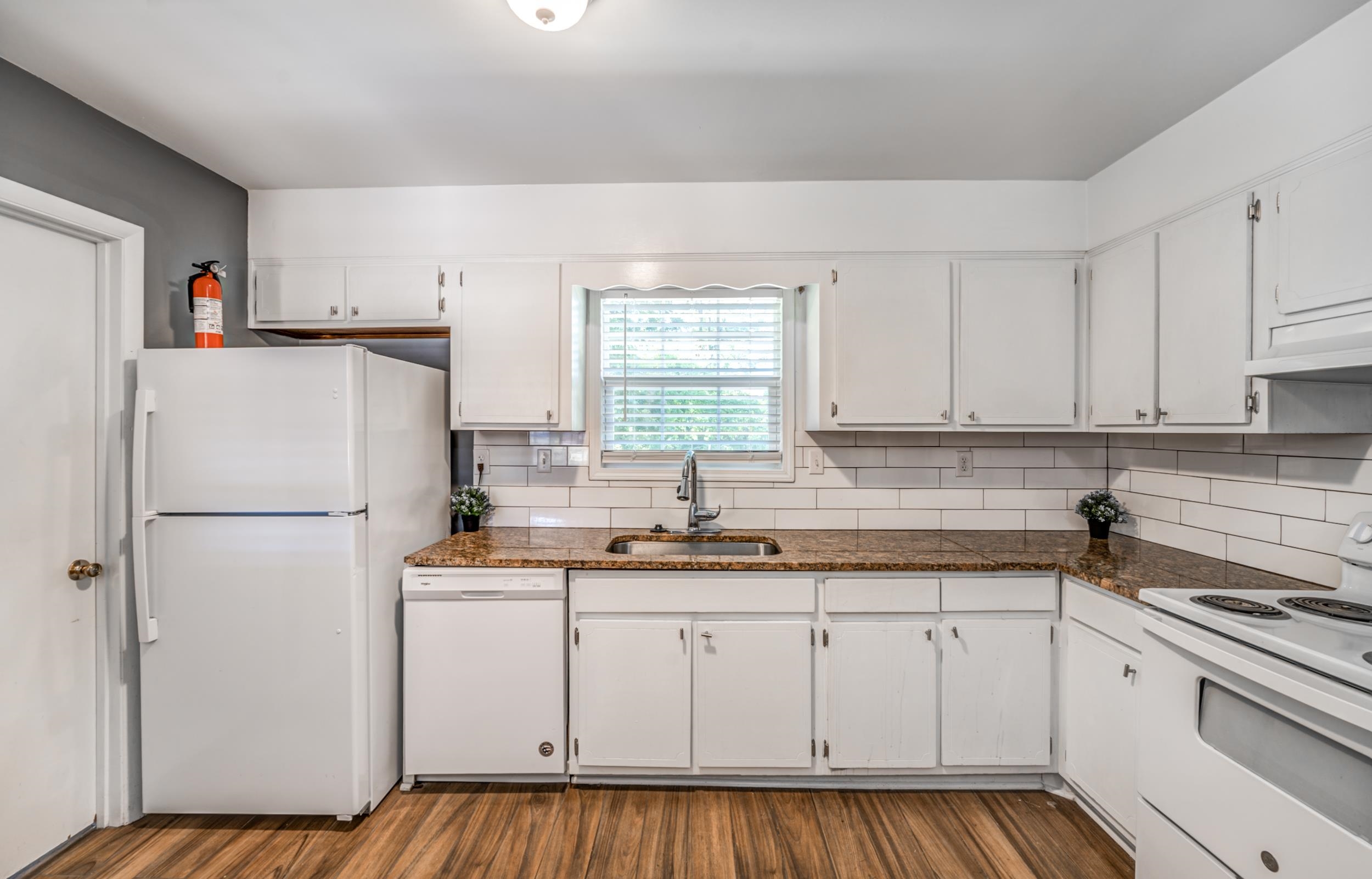 2865 Knightway Road Memphis, TN 38118 - Photo 8 of 19 a white refrigerator freezer sitting inside of a kitchen