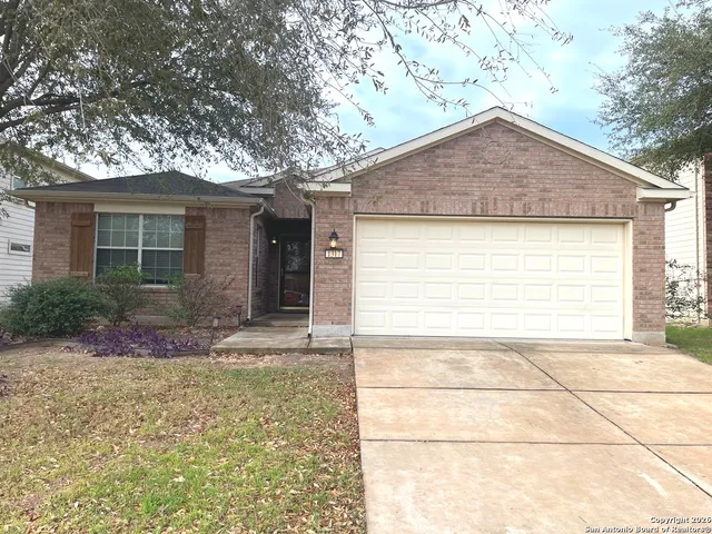 a view of house with backyard