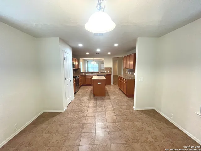 a large bathroom with a sink and a mirror