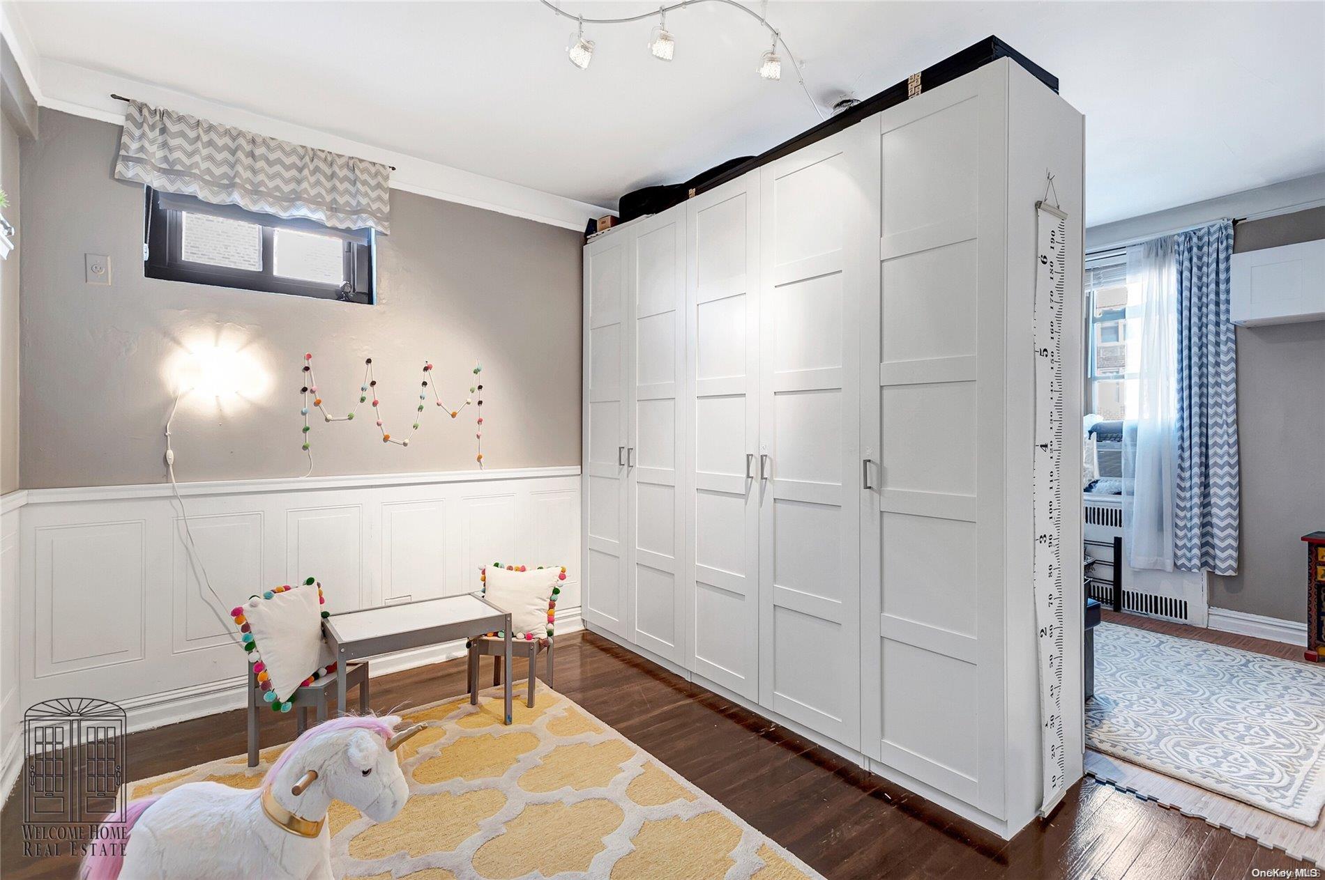 41-42 50th Street, Unit 4E Queens, NY 11377 - Photo 8 of 11 a chair and table in a room