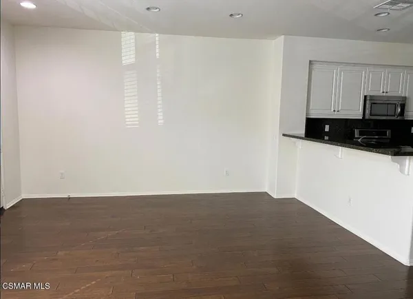 a view of a kitchen with a sink