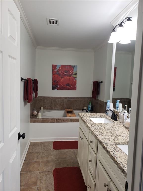 108 Millers Lane Calhoun, GA 30701 - Photo 13 of 21 a spacious bathroom with a granite countertop sink and a mirror