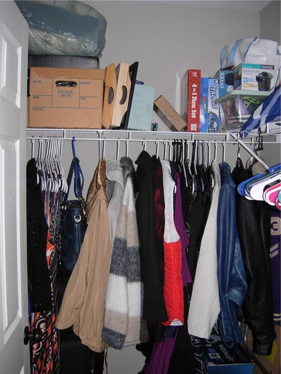 108 Millers Lane Calhoun, GA 30701 - Photo 16 of 21 a view of walk in closet with clothes and shoes