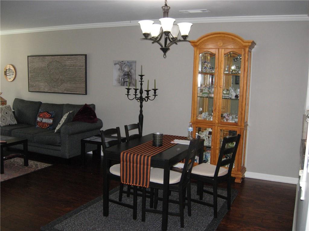 108 Millers Lane Calhoun, GA 30701 - Photo 3 of 21 a view of a dining room with furniture and wooden floor