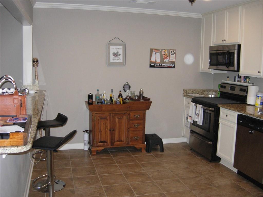 108 Millers Lane Calhoun, GA 30701 - Photo 7 of 21 a kitchen with a sink and cabinets