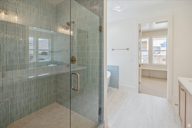 952 Mathilda Drive, Unit 156 Saratoga Springs, UT 84045 - Photo 16 of 25 Glass-enclosed shower with vertical subway tile, integrated bench, and bronze fixtures