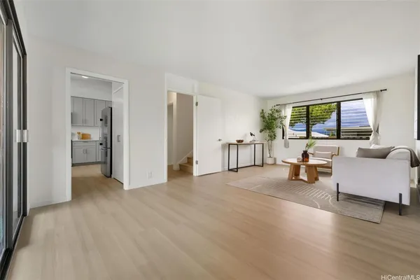 a living room with furniture and a large window