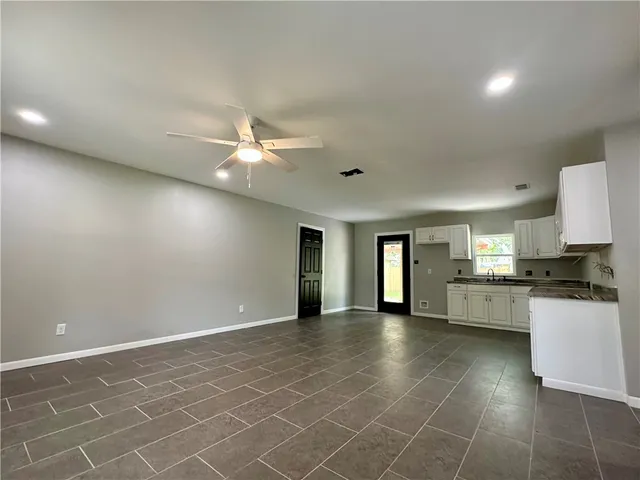 a view of a kitchen with a sink cabinets and window