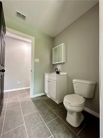 a bathroom with a toilet and a sink