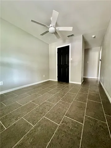 a view of an empty room with a sink