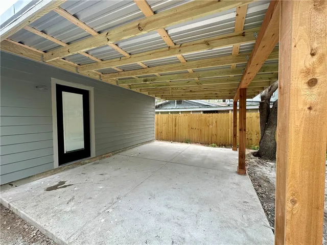 a view of a room with wooden walls