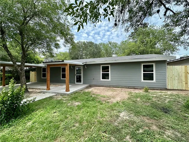 a backyard of a house with seating space
