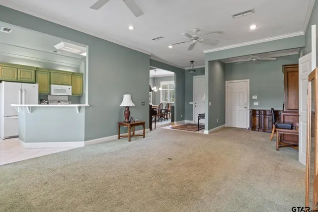 an empty room with furniture and windows